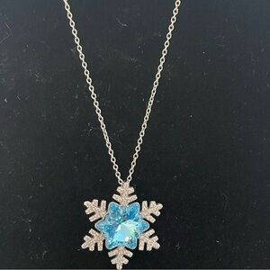 Elegant Silver-Toned Snowflake Necklace with Blue Gem